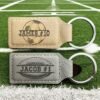 Personalized football keychains in tan and gray vegan leatherette engraved with names and numbers
