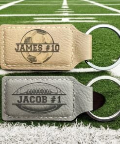 Personalized football keychains in tan and gray vegan leatherette engraved with names and numbers