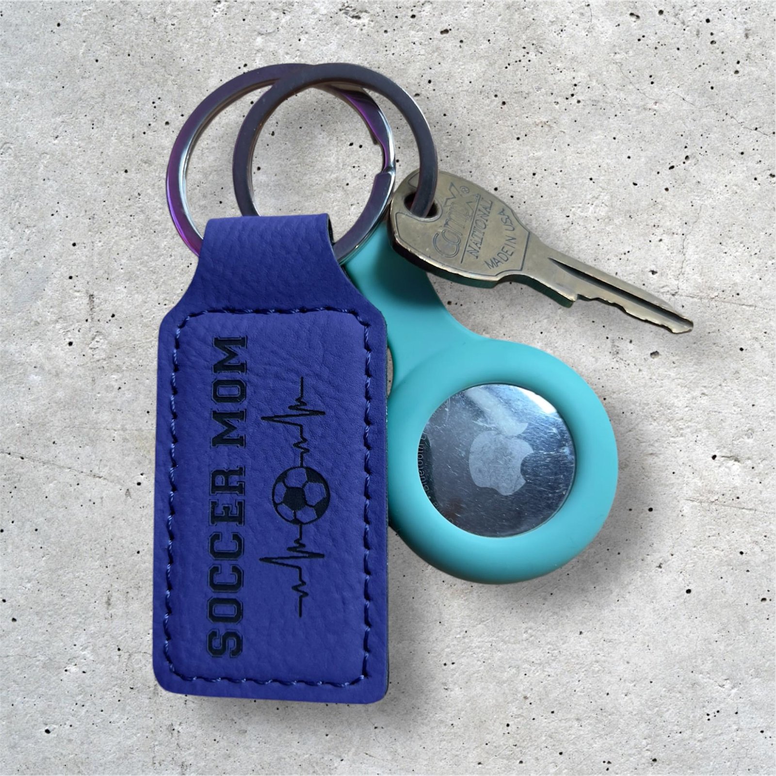 Purple vegan leatherette keychain engraved with the words Soccer Mom